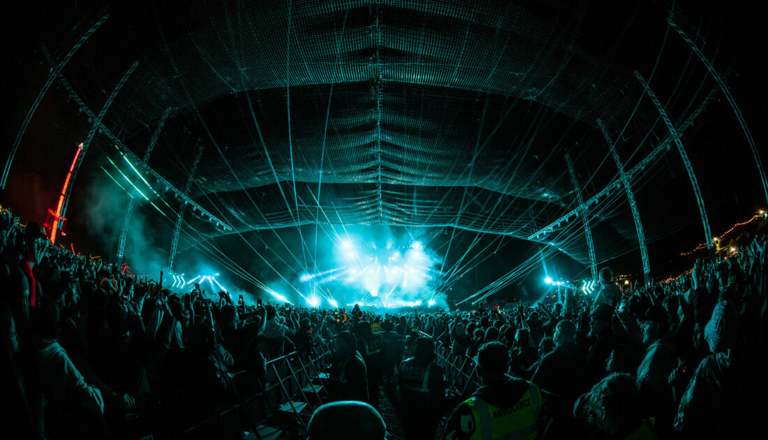 Fans under the blue LED lights of the Chevron Stage at Leeds Festival