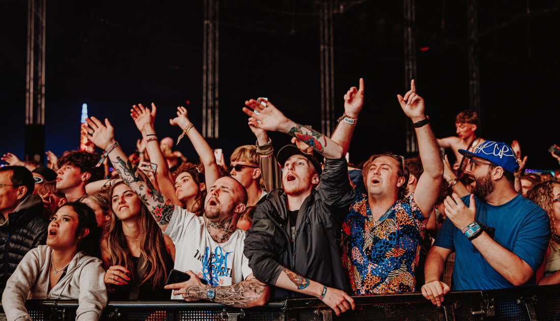 Fans enjoying show at the barricade at Leeds Festival 