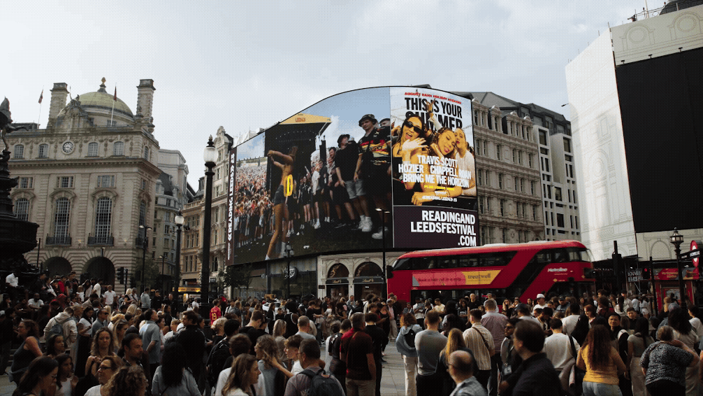 screen at piccadilly circus london showcasing Reading and Leeds line up for 2025 