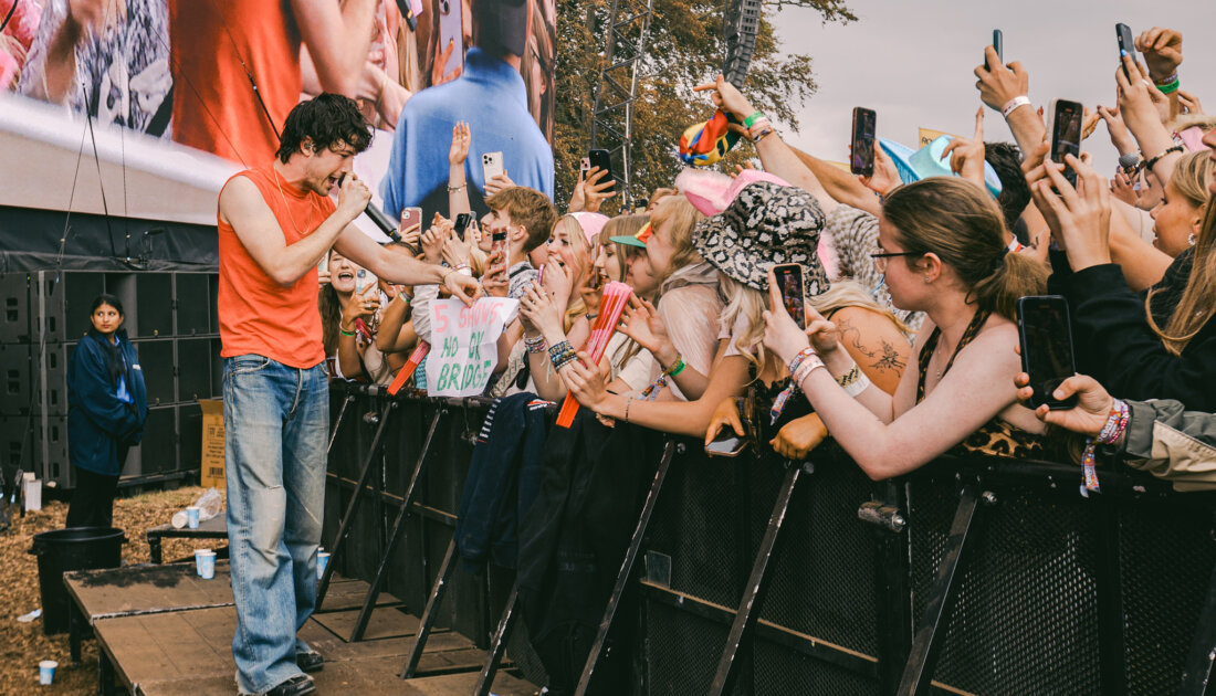 Lead singer of The Wallows Dylan Minnette singing to crowd of fans at Leeds Festival 